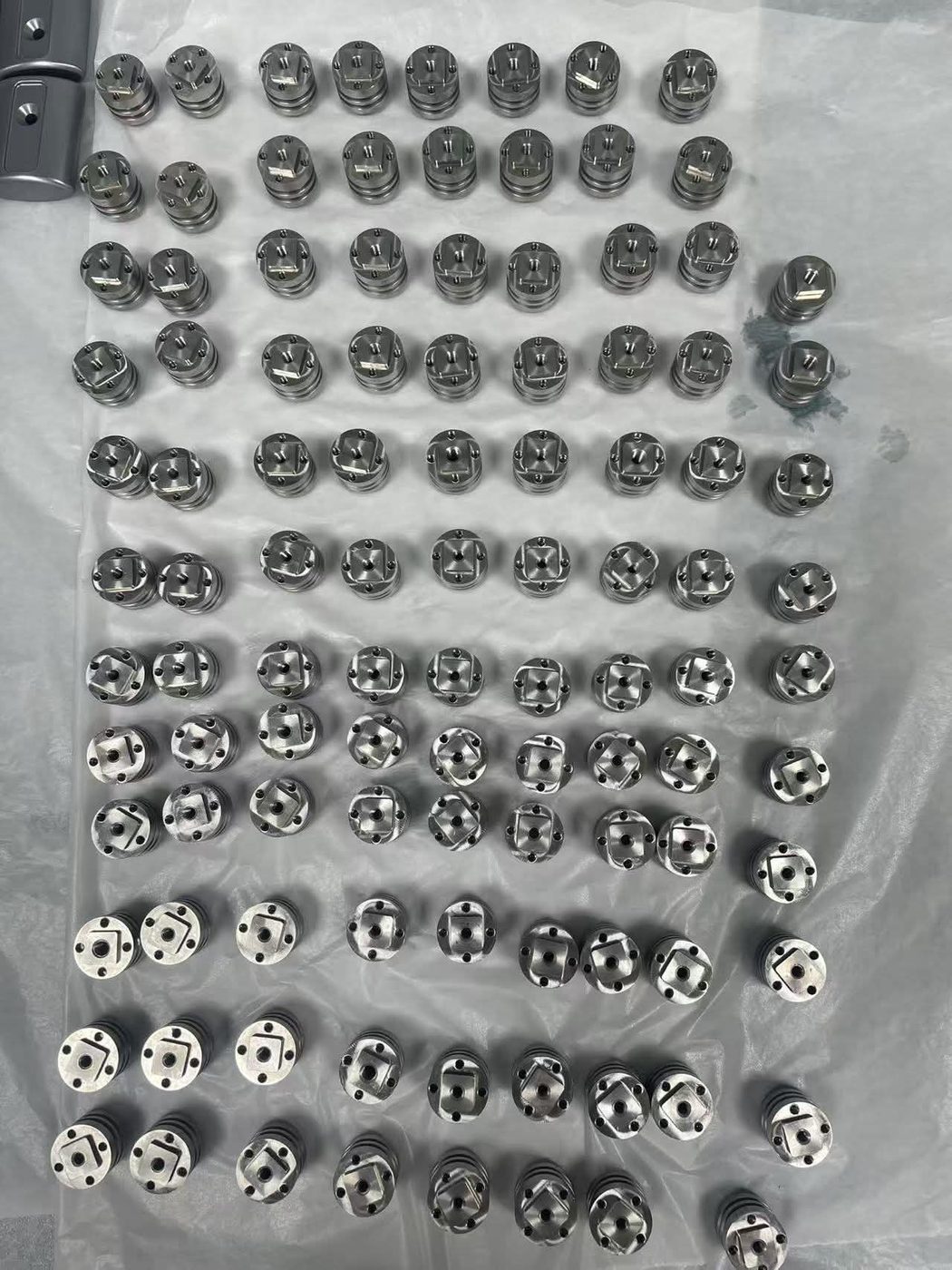 Precision-machined stainless components — full production batch